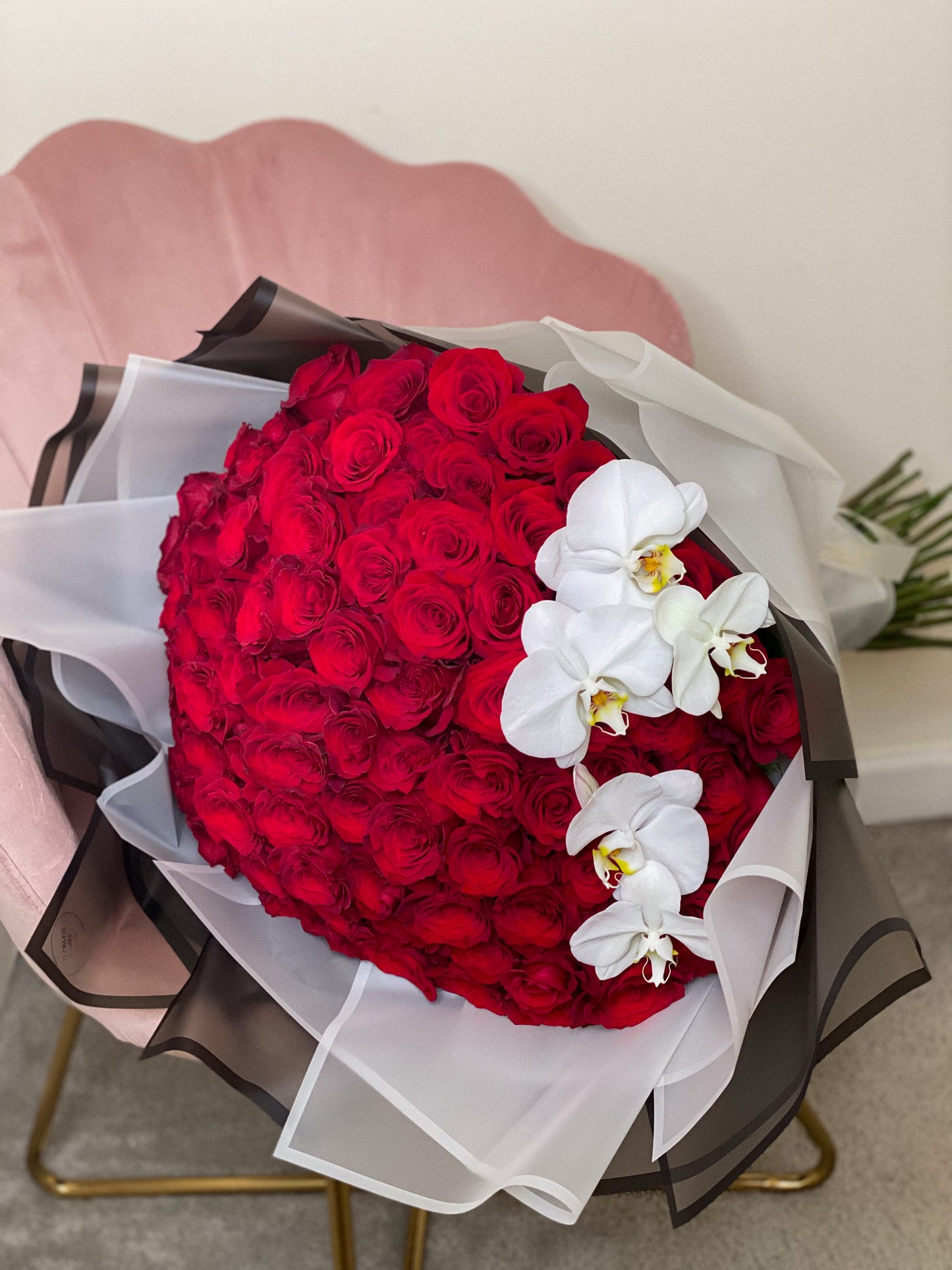 75 long stem roses and orchids ( at the picture 100 roses)