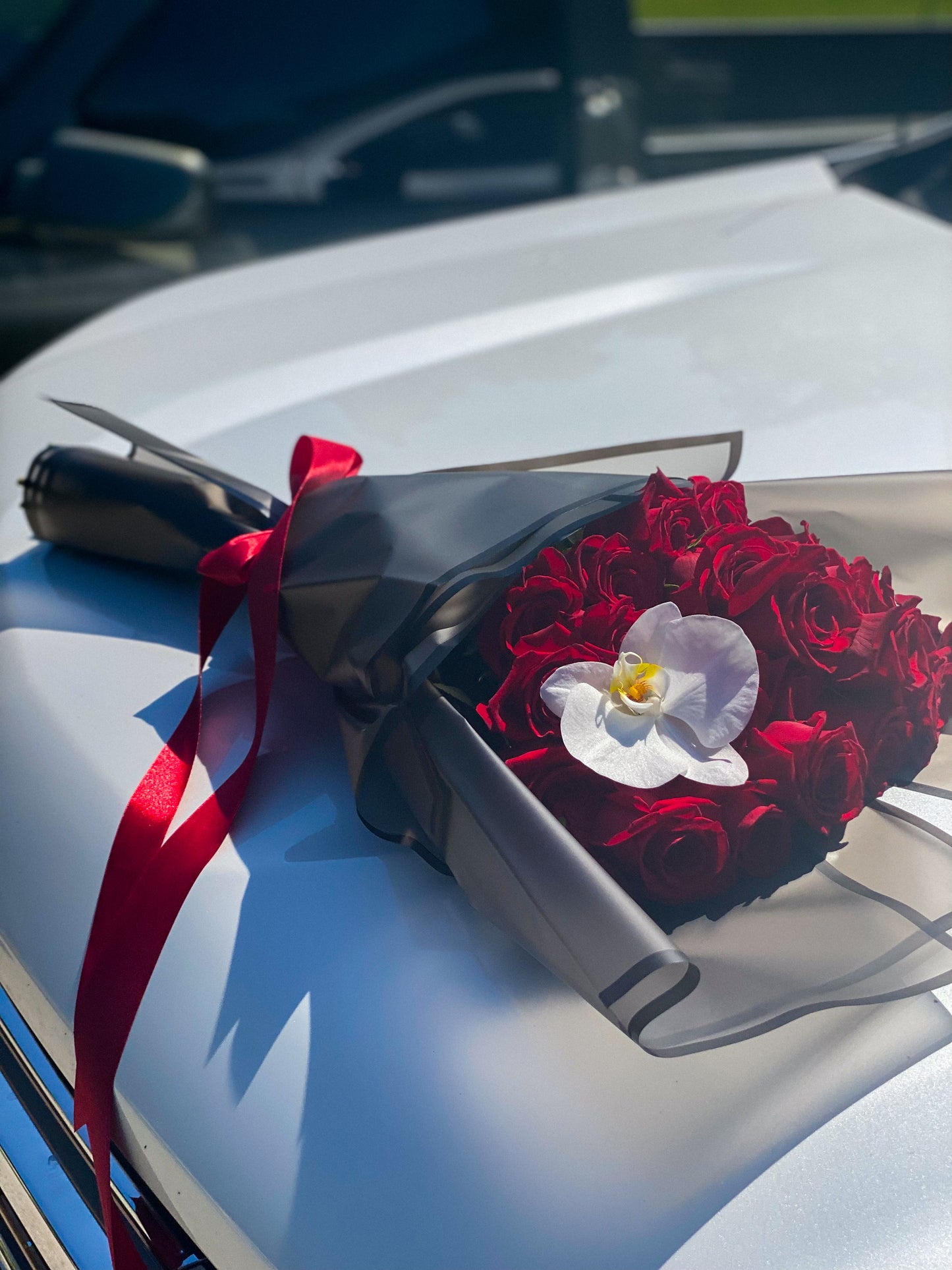 24 long stem roses and orchids