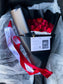 Dozen Red Premium LONG STEM Roses covered in colored waterproof paper                            (on the picture 25 roses )
