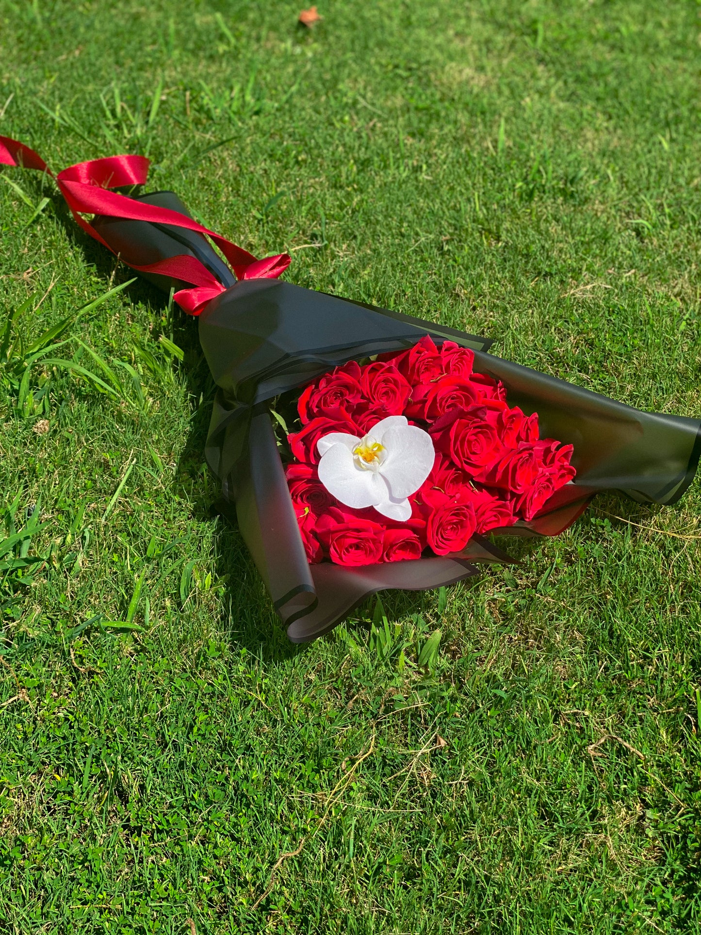24 long stem roses and orchids