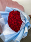 50 red roses in blue wrapping paper