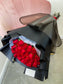 Dozen Red Premium LONG STEM Roses covered in colored waterproof paper                            (on the picture 25 roses )