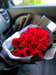 Dozen Red Premium LONG STEM Roses covered in colored waterproof paper                            (on the picture 25 roses )